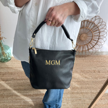 Bolso cremalleras piel negro iniciales bordadas