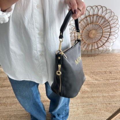 Bolso cremalleras piel negro iniciales bordadas