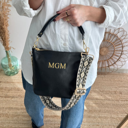 Bolso cremalleras piel negro iniciales bordadas