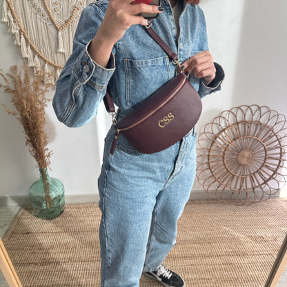 Riñonera/bandolera piel granate herrajes dorados iniciales bordadas